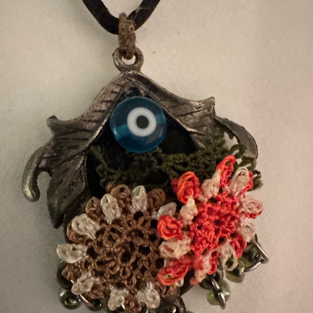 Evil Eye Pendant Necklace with Floral Accents. Leather chain. Handmade.